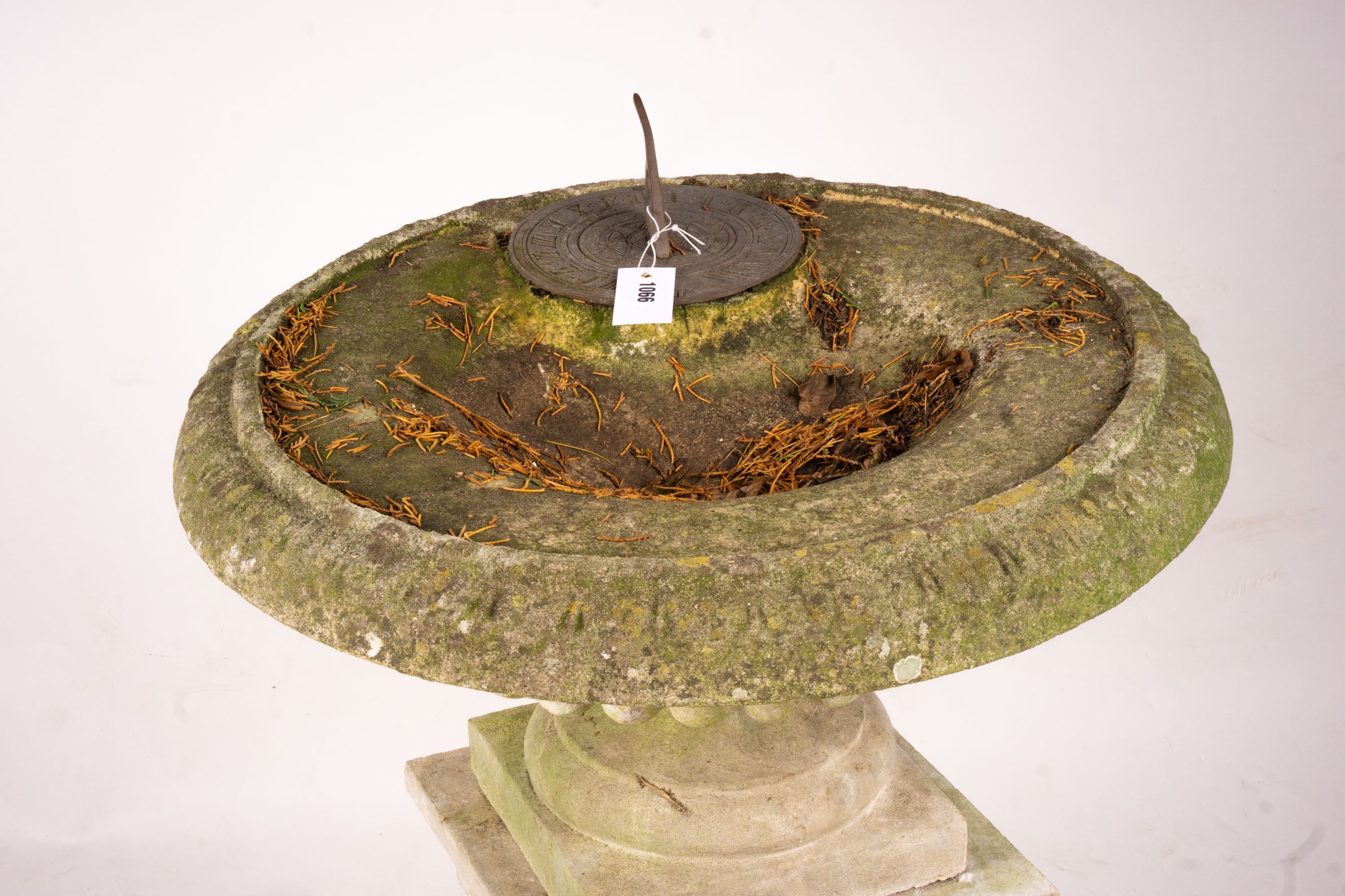 A reconstituted stone garden bird bath combined sundial on square pedestal base, height 108cm